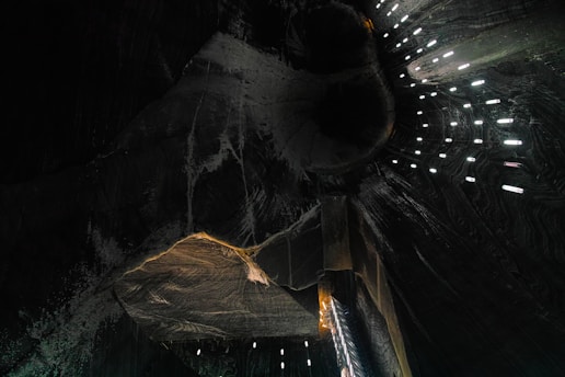 a large piece of art is lit up in the dark