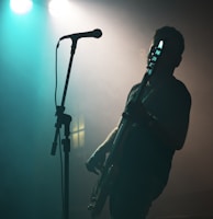 man holding electric guitar