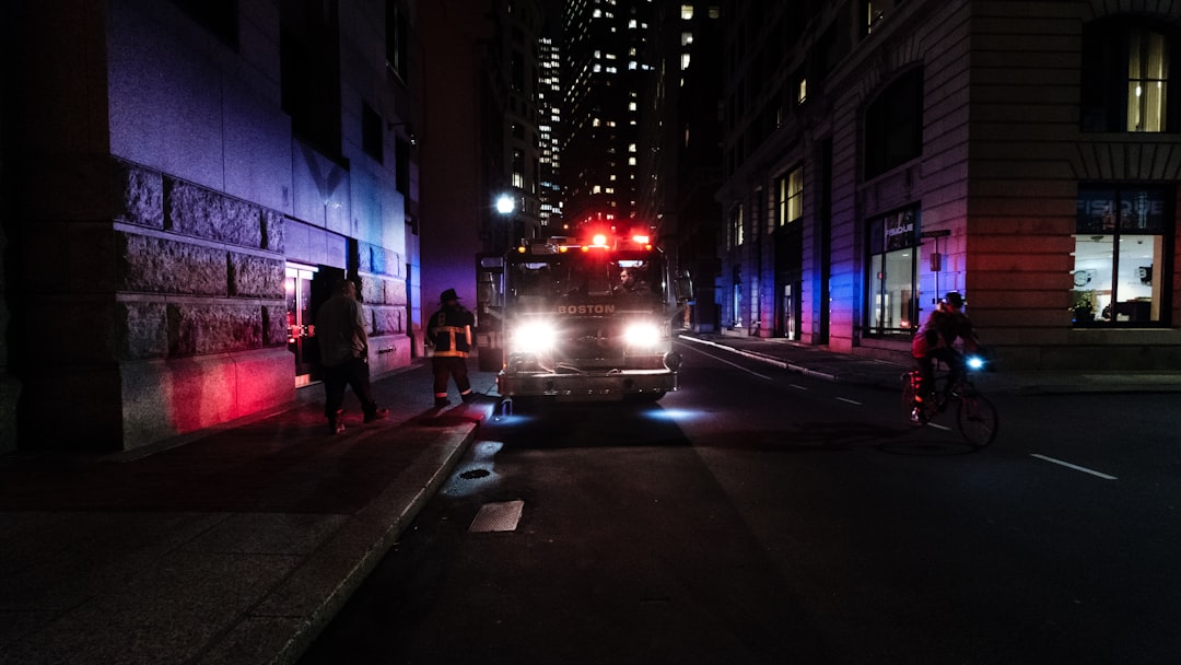 people walking on street during daytime, Boston firetruck parked on a street at night