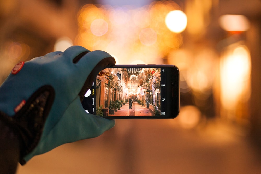 person holding black smartphone