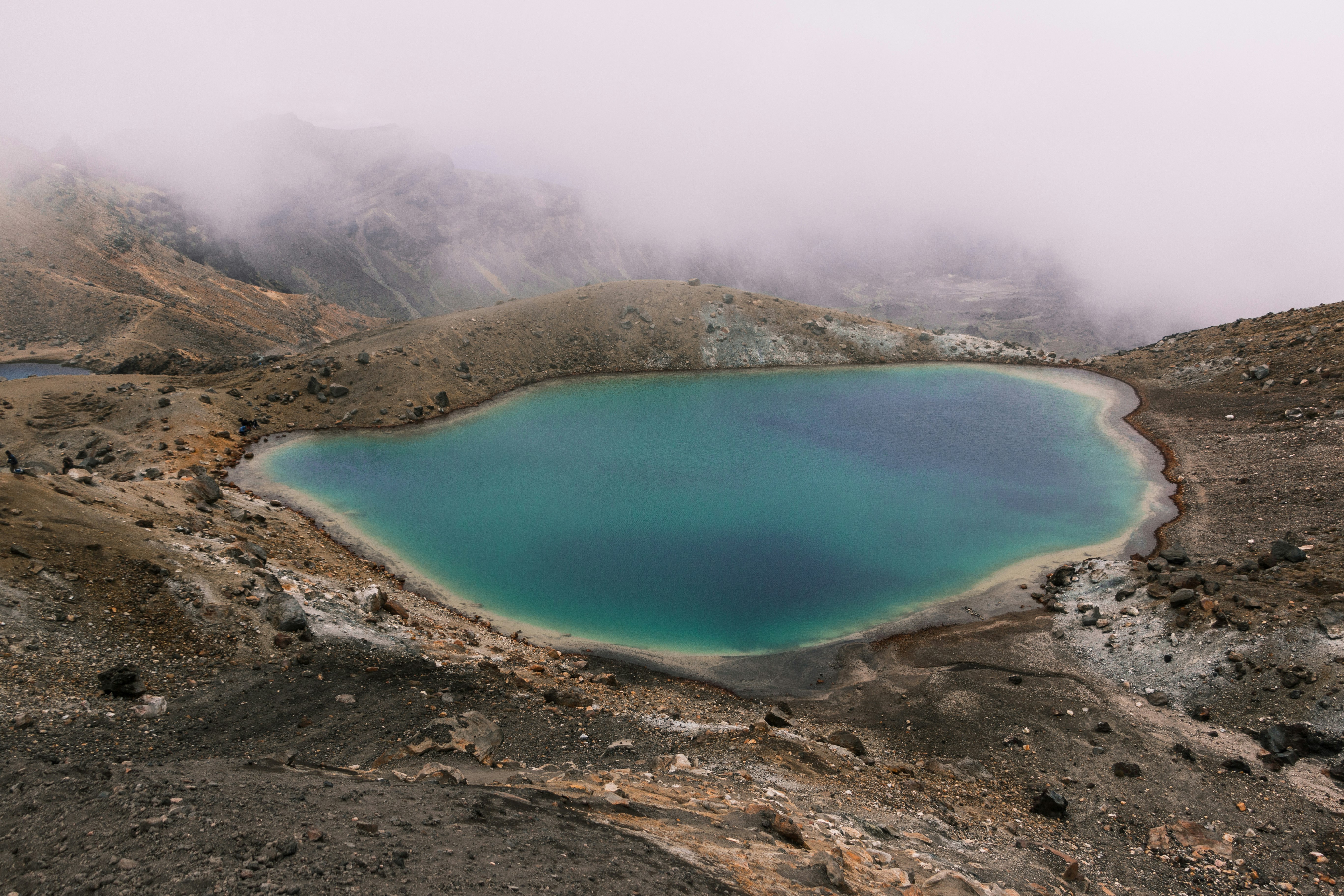 lake in the middle of mountain