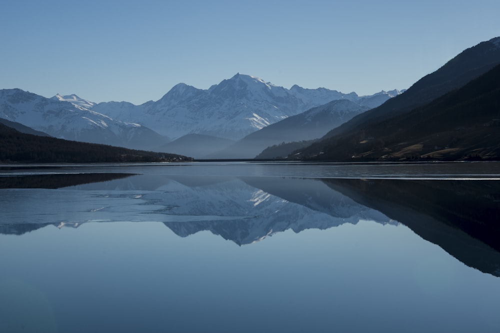 mountain near on body of water photo