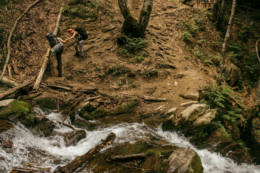 two person hiking in the mountain terrain