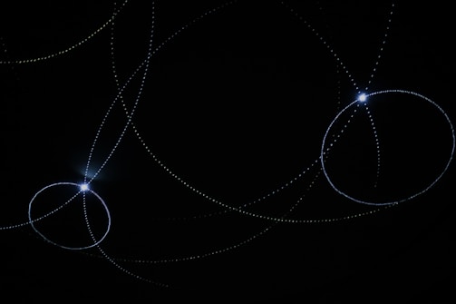 Dark background with glowing lines illustrating data flow in a scalable system.