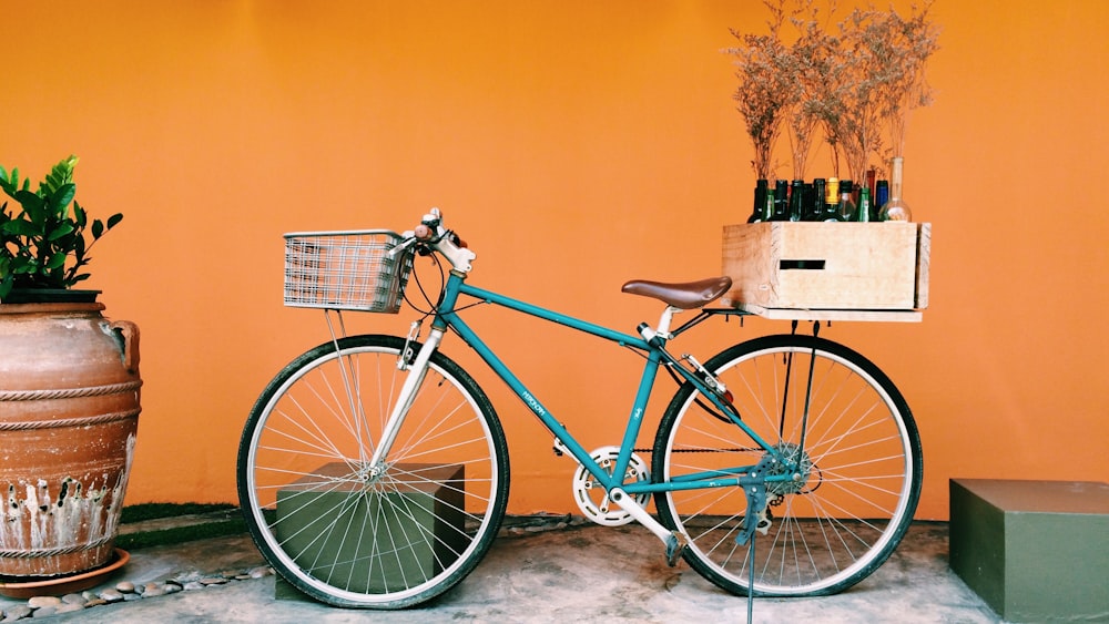 blue and black city bike on white flooring