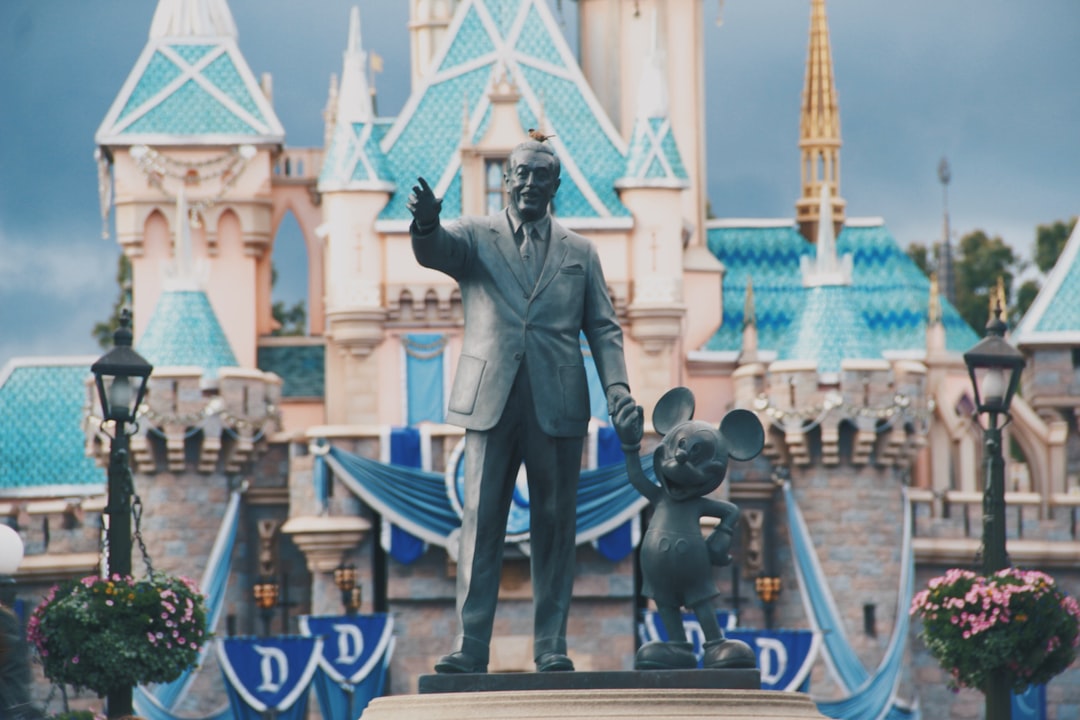 man holding rat concrete statue, Walt & Mickey Please do not use my photo for offensive content.