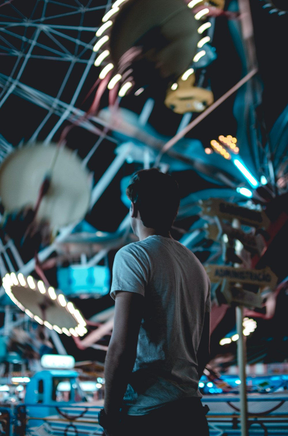 man standing near amusement park during daytime