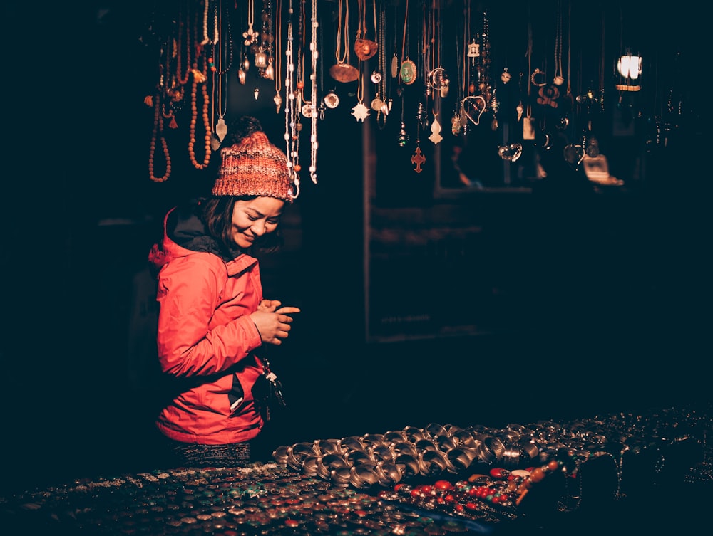 woman looking on assorted jewelr