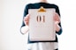 person holding calendar at January