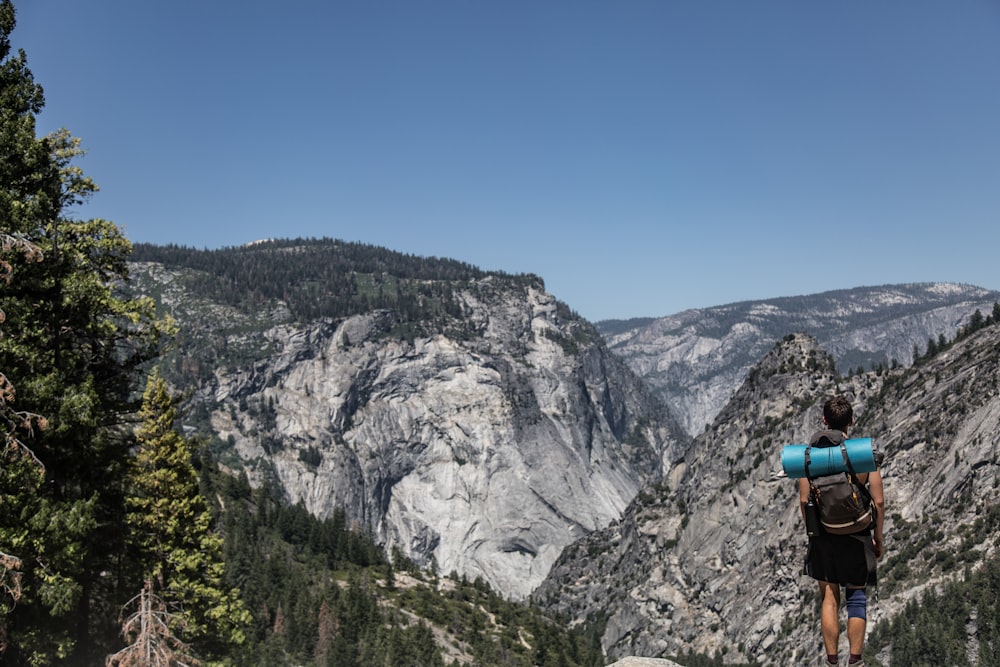 man standing on cliff