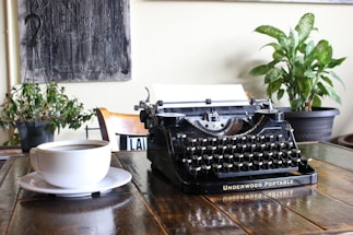 A serene workspace with a typewriter and coffee.