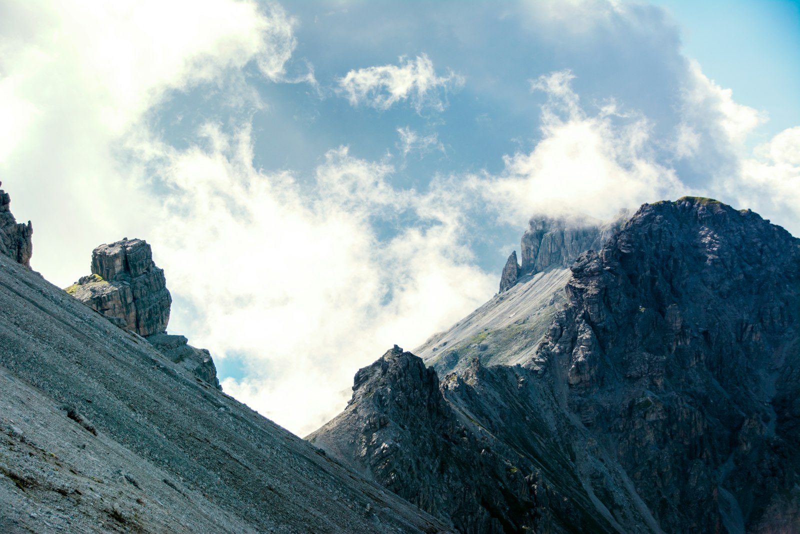 Sigma 18-250mm F3.5-6.3 DC Macro OS HSM sample photo. Mountain under cloudy skies photography