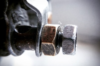 Technician inspecting high-strength bolts with precision tools.