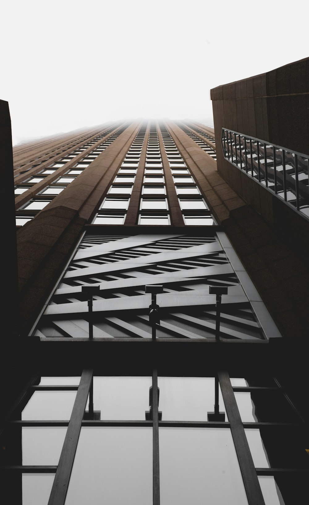 brown and clear curtain wall building close-up photography