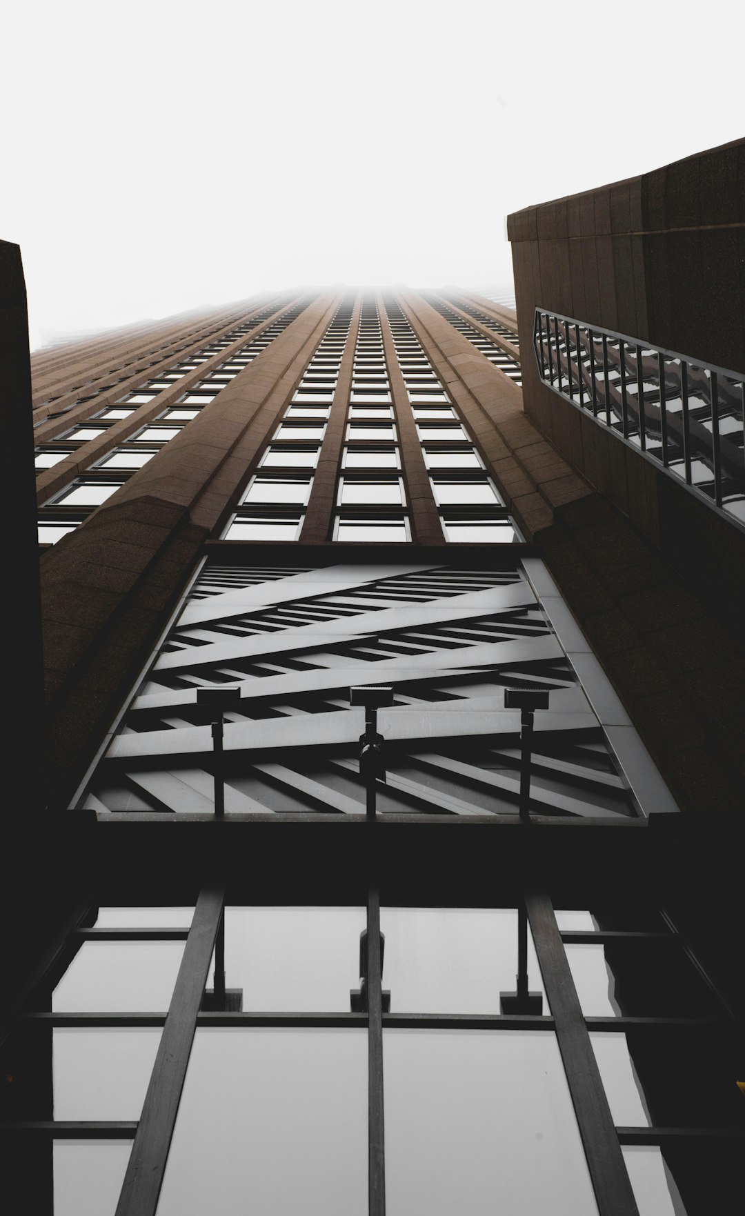 brown and clear curtain wall building close-up photography