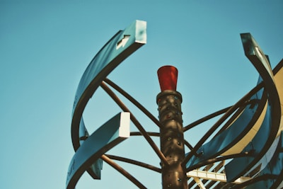 Sculptural metal installation blending sharp angles and smooth curves.