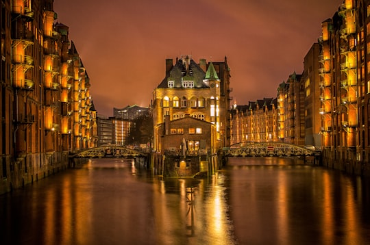 view of building with suspension bridge by the water in Speicherstadt Germany