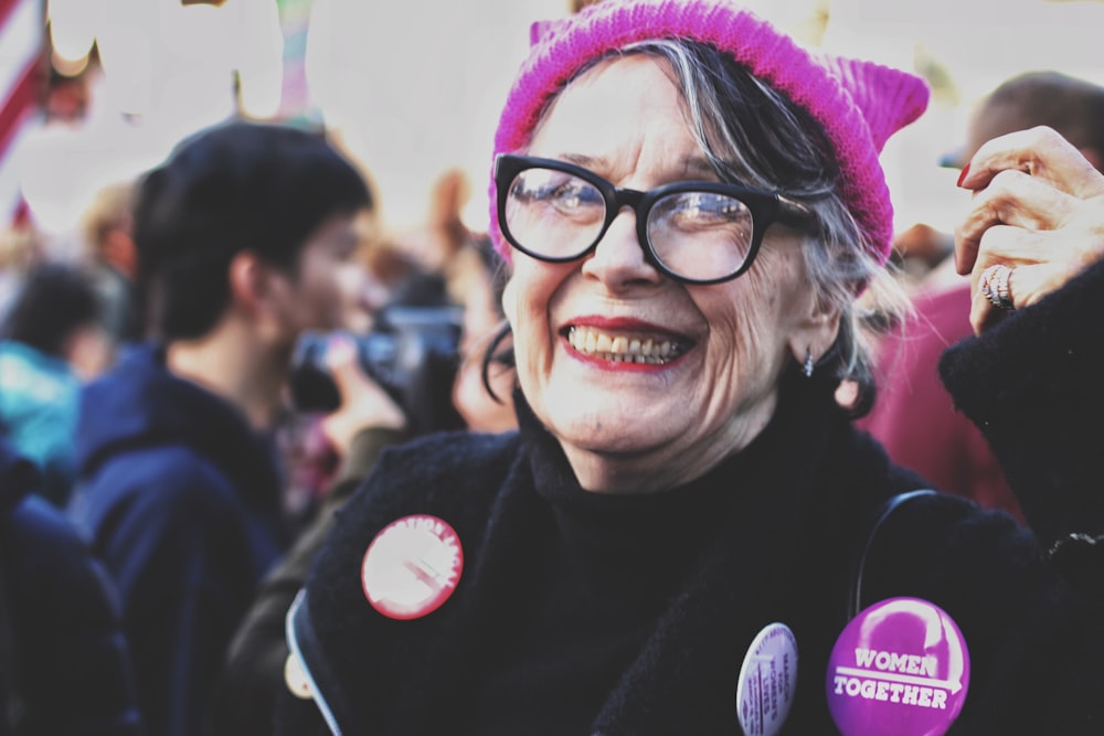 woman smiling near people