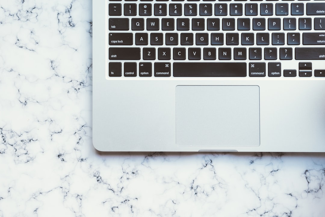 MacBook Pro on white marble surface