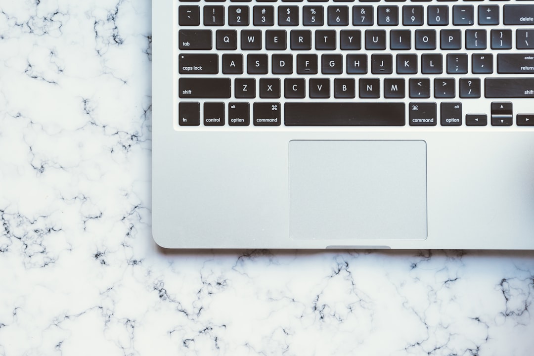 MacBook Pro on white marble surface, Minimal laptop keyboard