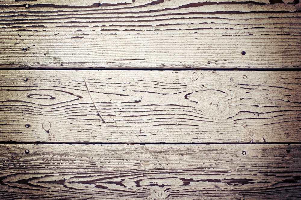 a close up of a wooden surface with knots