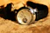 Close-up of a sleek black Italian leather watch strap on a luxury Rolex.