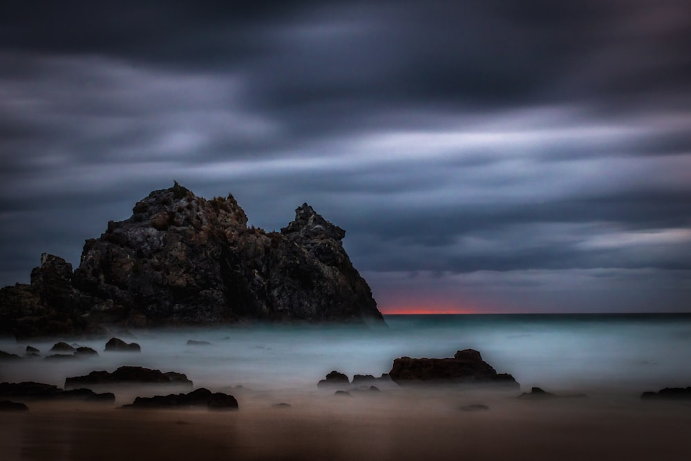 landscape photography of sea and rock formations