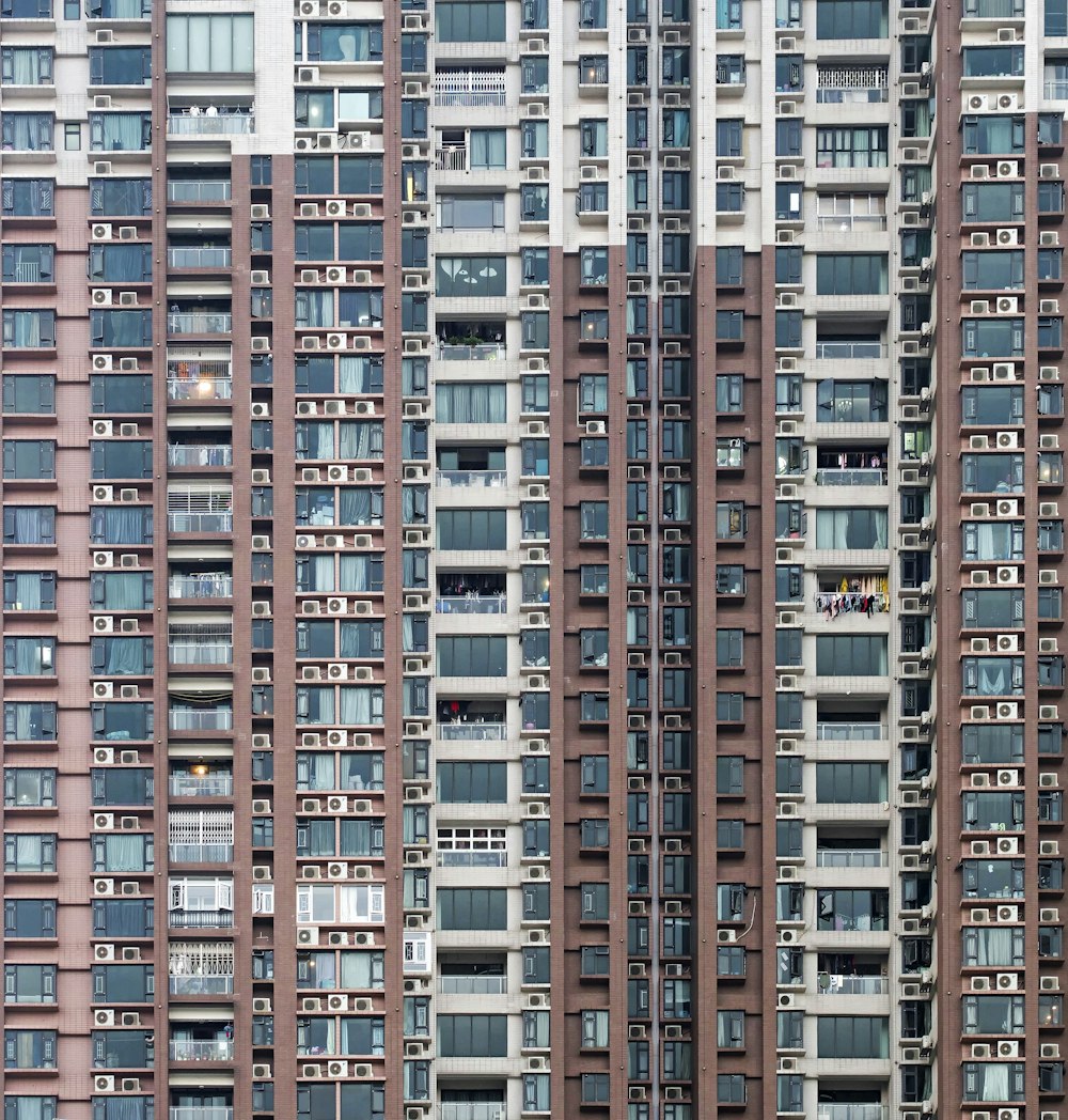 photo of brown and white high-rise building