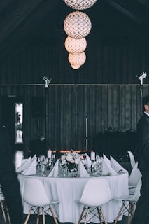 round white and brown dining set with ball pendant lamps photography