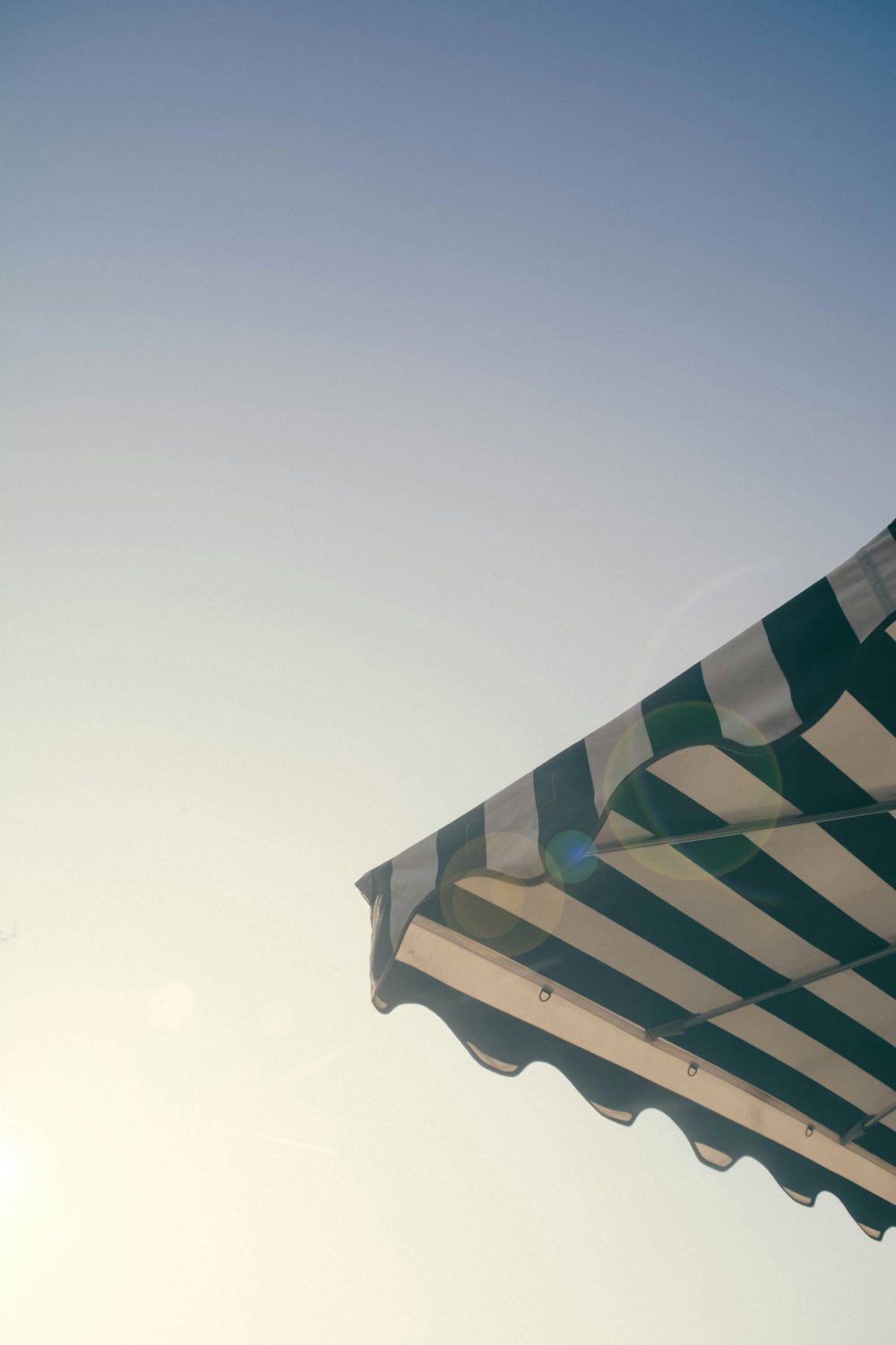 white and green striped umbrella