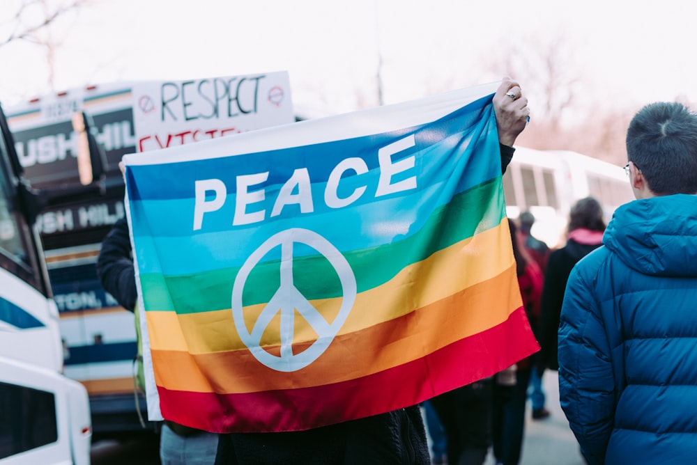 person holding peace flag