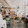 people eating inside of cafeteria during daytime