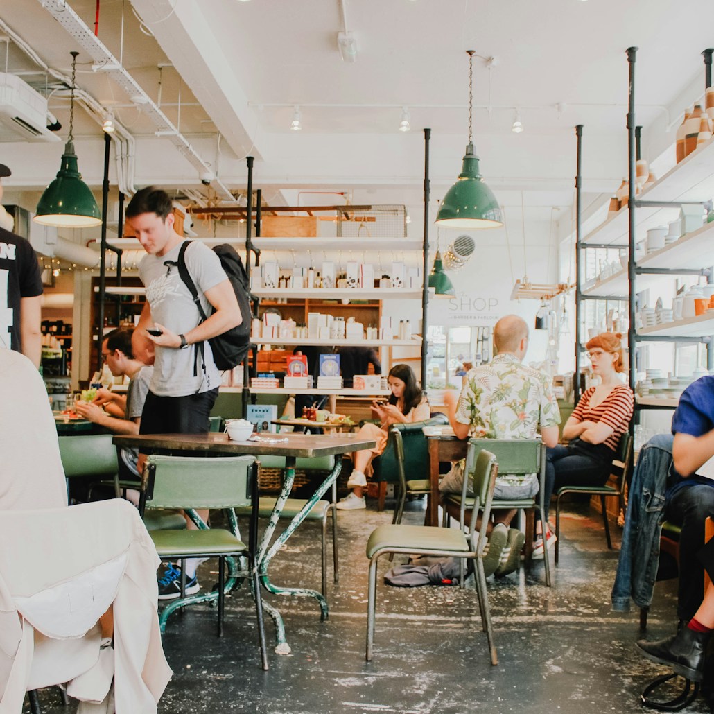 people eating inside of cafeteria during daytime