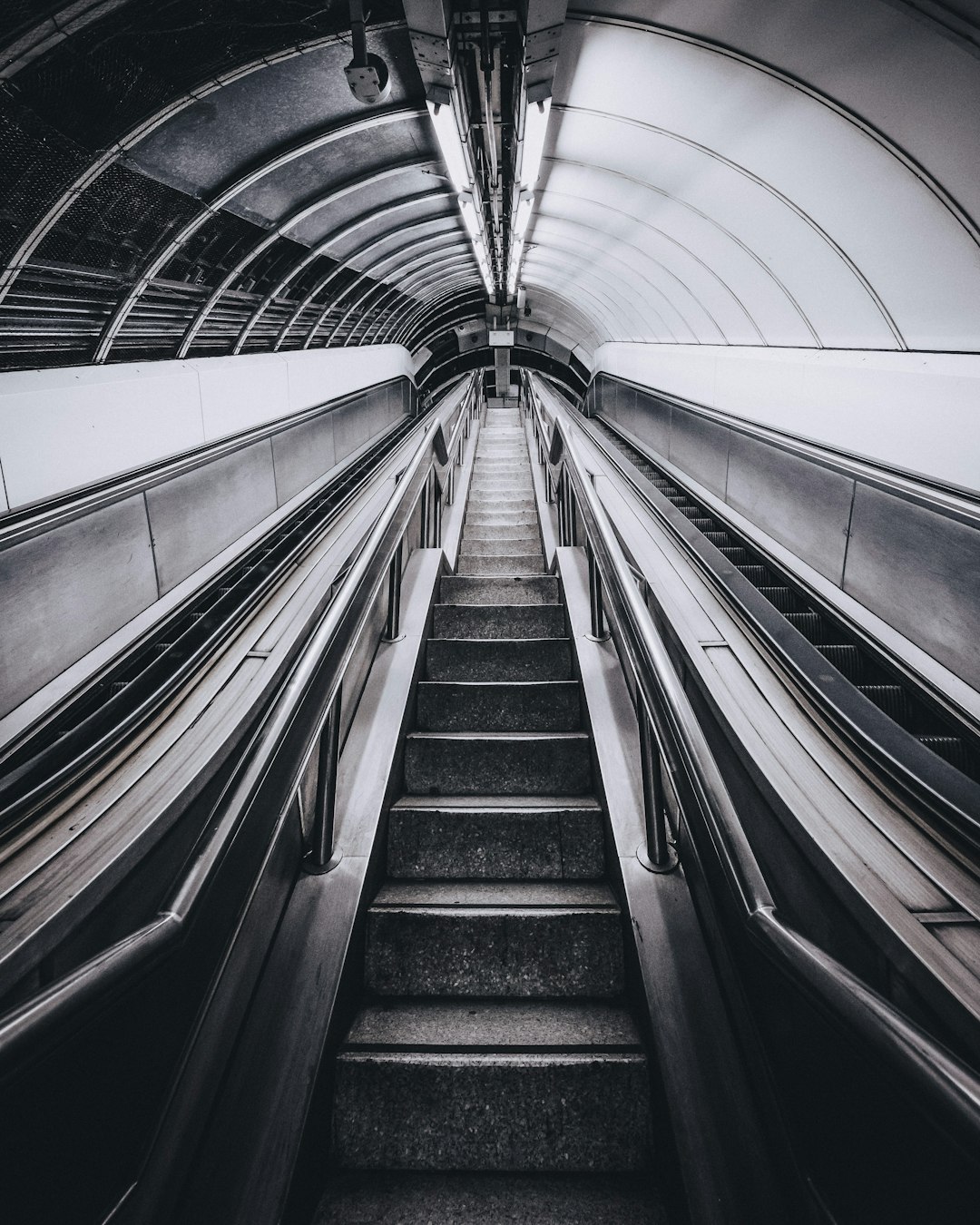 grayscale photo of escalator