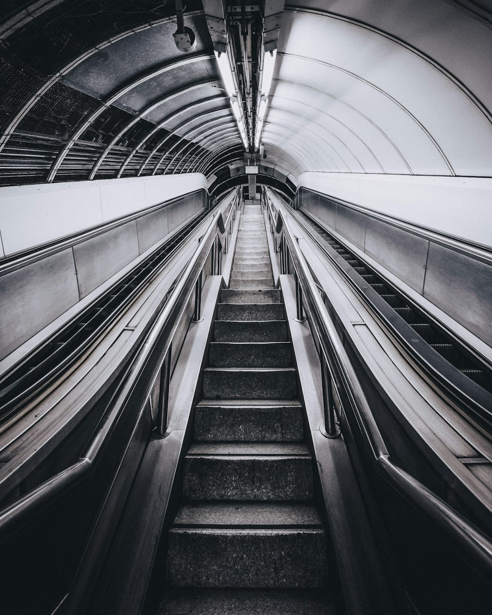 grayscale photo of escalator