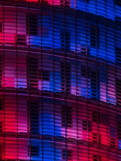 A sleek, modern grid layout of diverse creators, each captured in bold, expressive poses with neon highlights