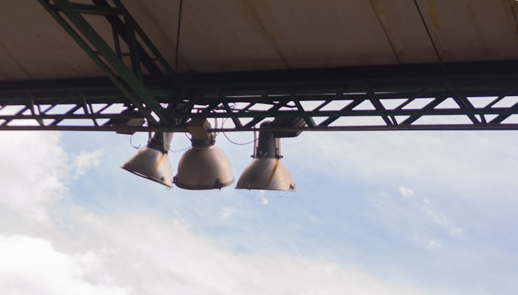 Industrial warehouse roof with Prime Fix fasteners securely installed under bright daylight.