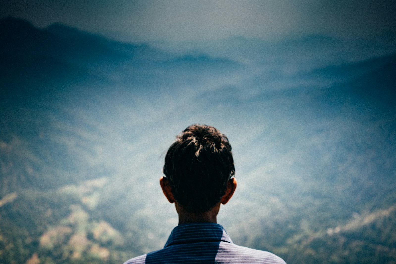 Sony a7S sample photo. Man facing green mountains photography