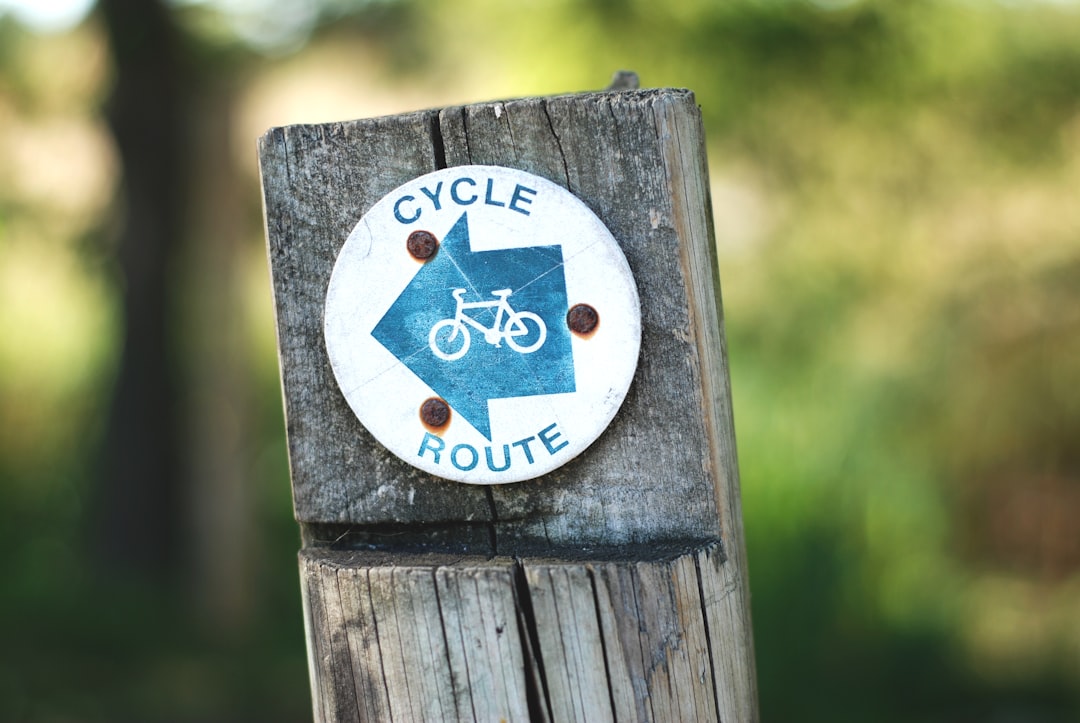 cycle route sign on a wooden post, A sign making a cycle route in the countryside.