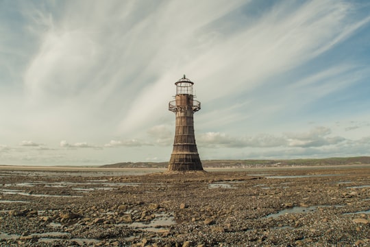 brown lighthouse during daytime in Whiteford Lighthouse United Kingdom
