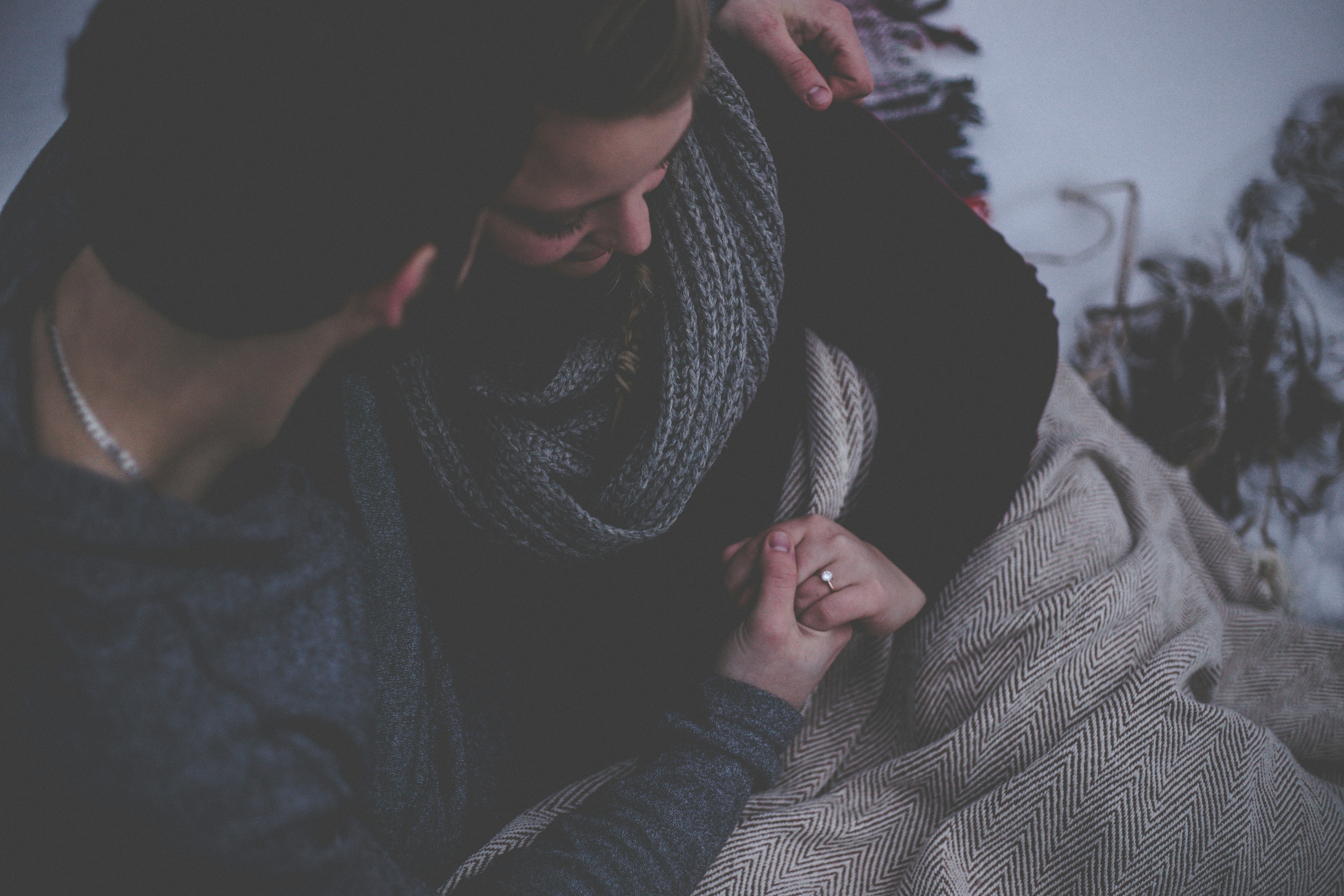 Seated couple snuggling
