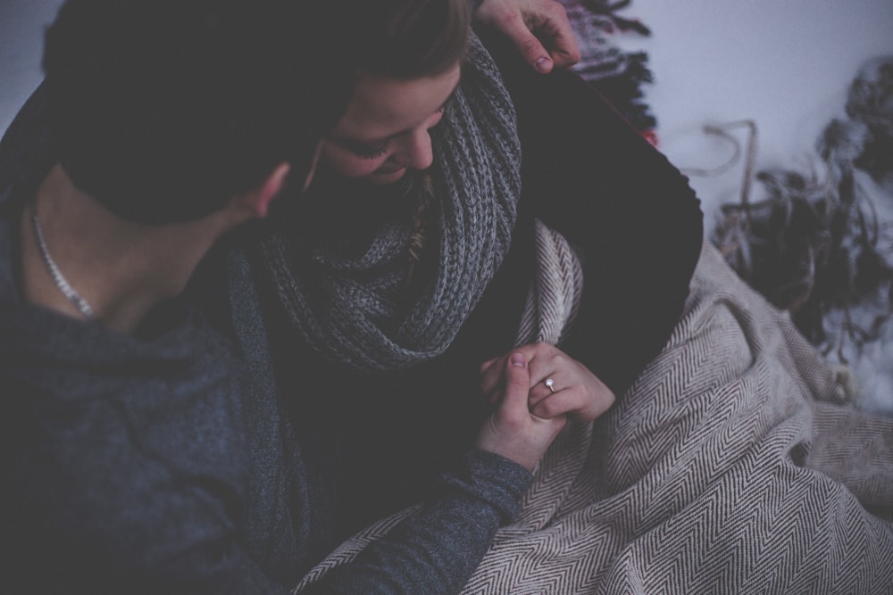 couple with grey blanket