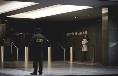 security guard standing on the gray floor