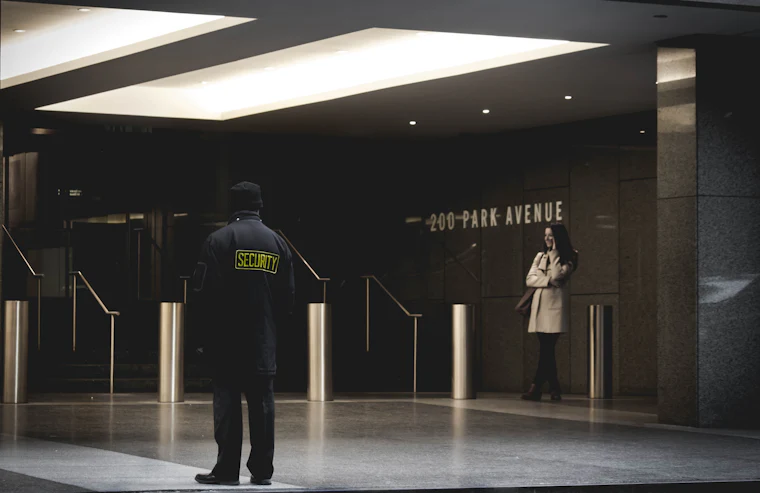 Uniformed security personnel on duty at premises entrance