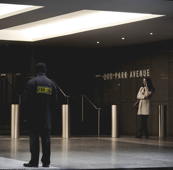 security guard standing on the gray floor