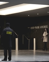 security guard standing on the gray floor