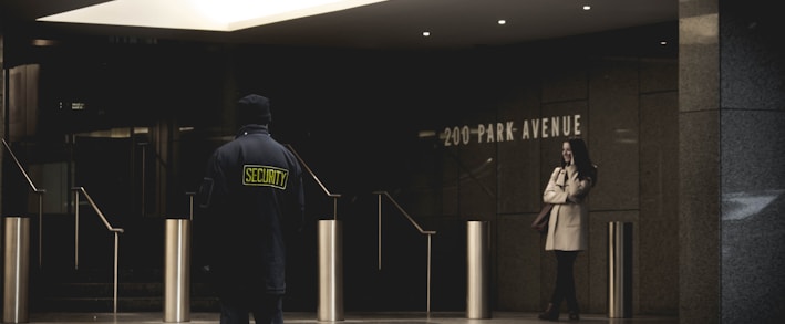 security guard standing on the gray floor