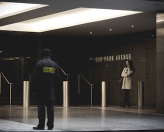 security guard standing on the gray floor