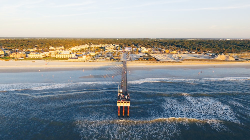 white, brown, and black oil rig under blue sky