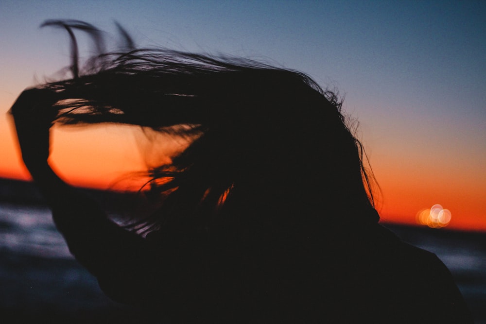 silhouet photo of woman hair